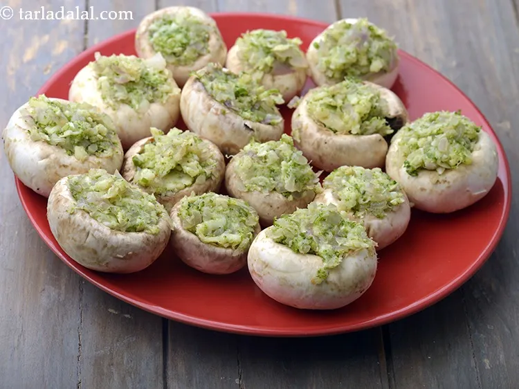 Step 15 – Stuff a portion of the prepared mixture into each mushroom cavity.