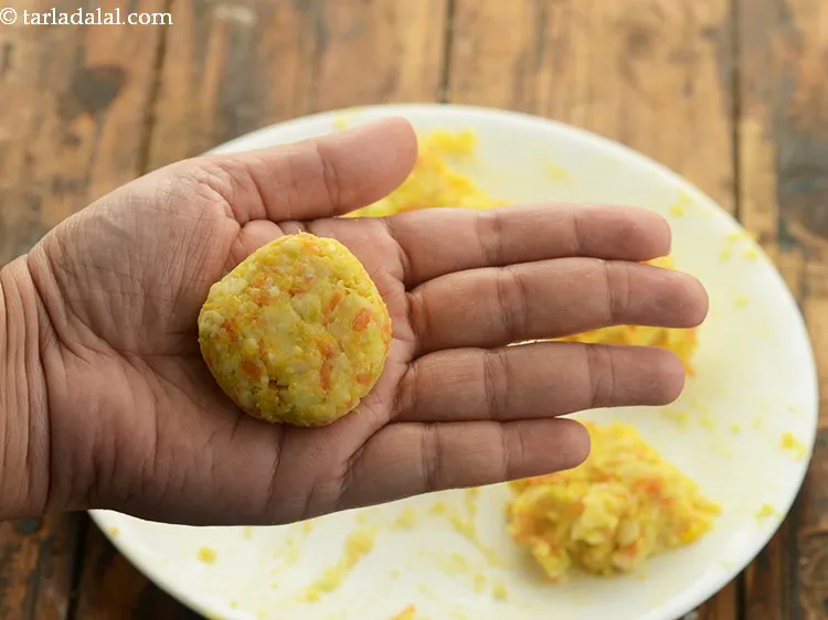 Step 20 – Shape each portion into a small round flat cutlet one by one.