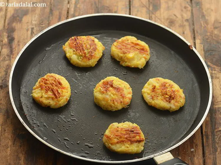 Step 22 – Cook them using &frac12; tbsp. of oil. Cook till they turn golden brown in colour …