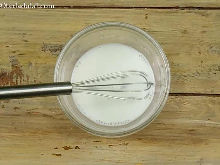 Step 2 – Add 2 tbsp of milk, mix well and keep aside. Ensure there are no lumps.