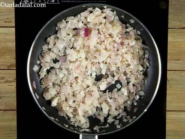 Step 13 – Heat the butter in a broad non-stick pan, add the onions and saut? on a …