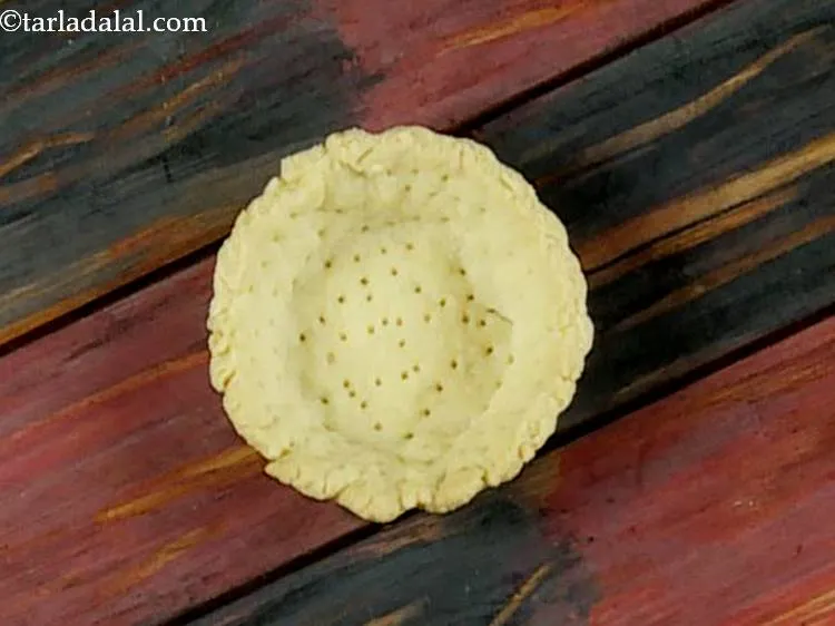 Step 16 – Place a tart on a clean, dry surface. Here is a recipe to <a href="/Tart-(-Eggless-Desserts-Recipe)-1135r">make …