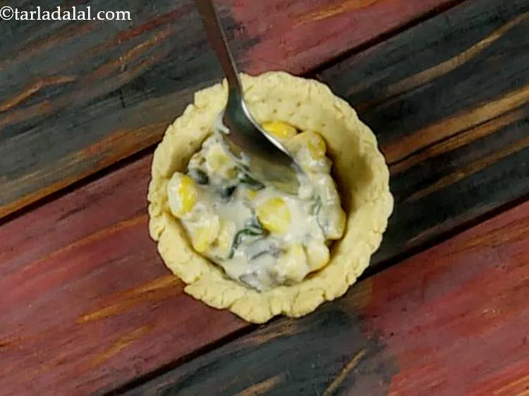 Step 17 – Fill it with a portion of the cheesy corn filling.