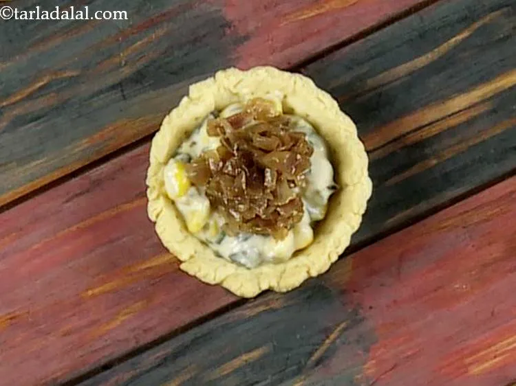 Step 18 – Put a portion of the caramelized onions evenly over it.