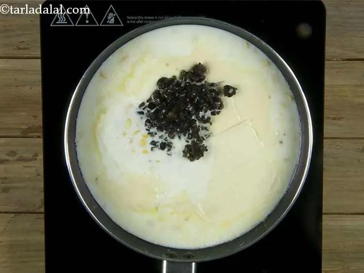 Step 7 – Then add the olives. We have used black olives in this recipe.