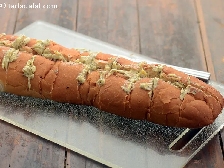 Step 8 – Apply the garlicky herb mixture in between the horizontal slits.