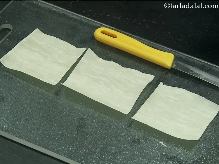 Step 15 – Cut each samosa patti into 3 to get 75 mm. X 62 mm. (3" x …
