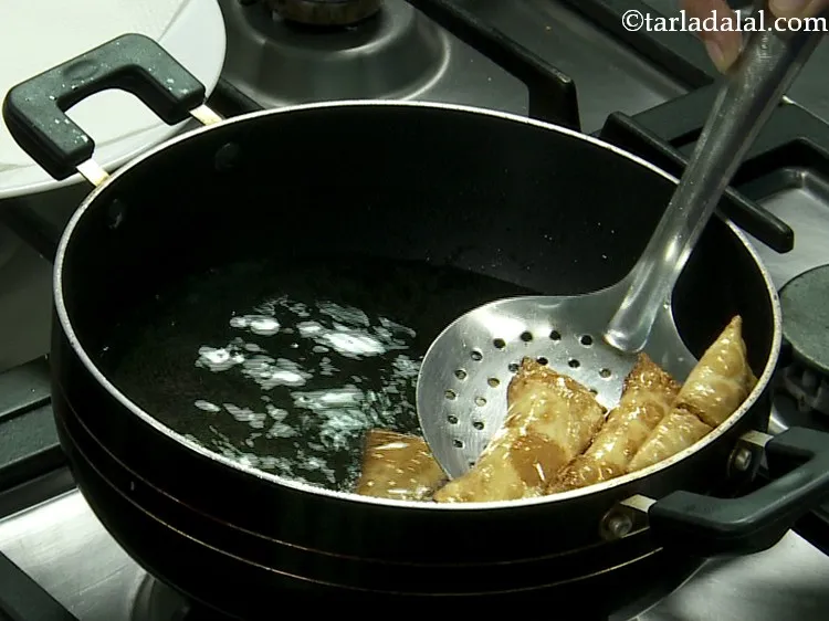 Step 22 – Flip and fry till they turn golden brown in colour from all the sides.