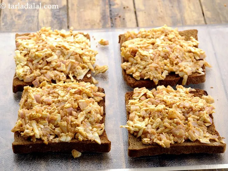 Step 8 – Spread 1 portion of topping on each bread slice.&nbsp;