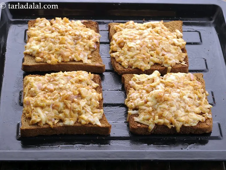 Step 10 – Place the toast on the greased baking tray.