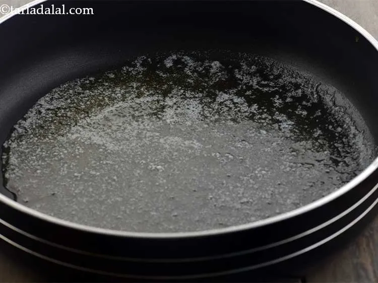 Step 2 – For the <strong>Cheesy Onion Grilled Sandwich, </strong>take a broad non-stick pan and add butter into …