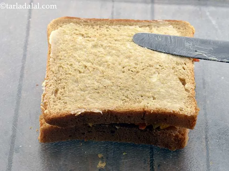 Step 20 – Apply another 1/2 tsp of butter on top of the bread for added flavor and …