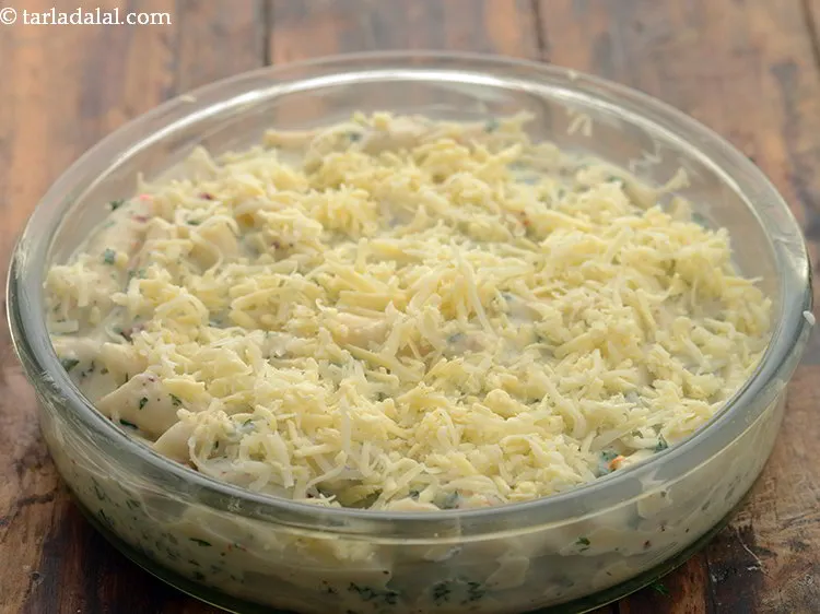 Step 31 – Top with the prepared cheese mixture. If you love a crunchy bite then sprinkle breadcrumbs …