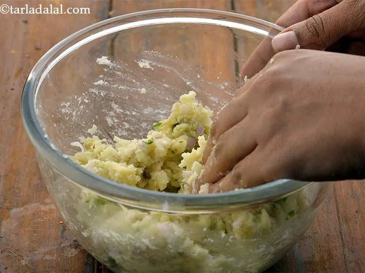 Step 15 – Mix very well to combine all the ingredients. Our cheesy potato mixture is now ready.