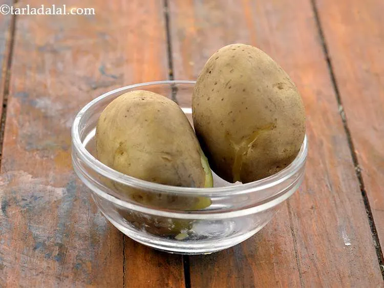 Step 3 – To make&nbsp;<strong>Cheesy Potato Balls (Potato Cheese Balls),&nbsp;</strong>first wash 2 medium sized potatoes and boil in …