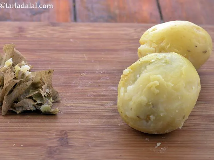 Step 4 – Once cooled, peel the potatoes and discard the skin.