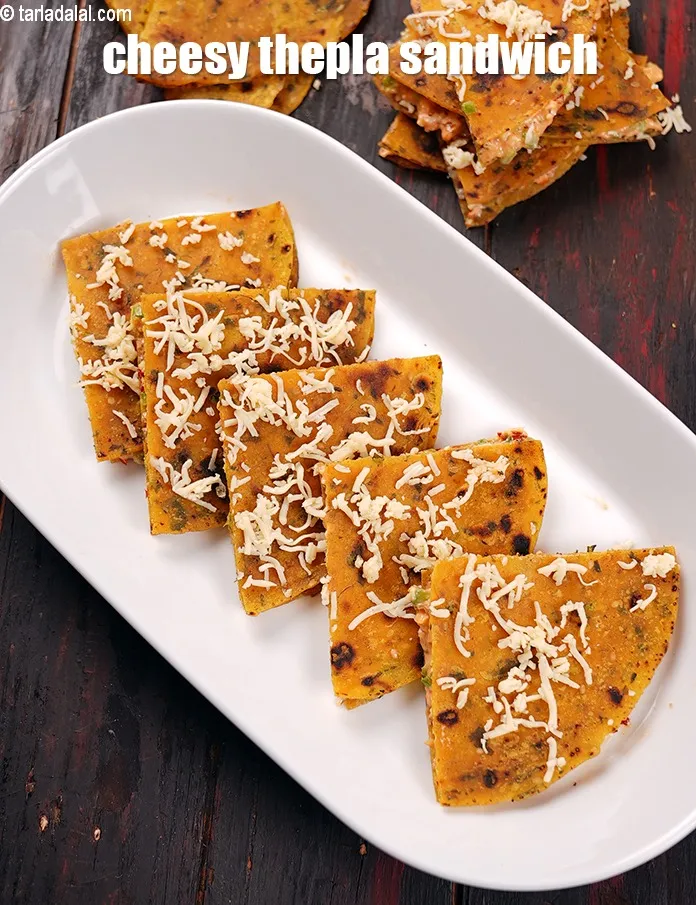 Step 21 – Serve <strong>thepla sandwich</strong> immediately with <a href="https://www.tarladalal.com/glossary-tomato-ketchup-tomato-sauce-181i">tomato ketchup</a> and <a href="https://www.tarladalal.com/green-chutney-22266r">green chutney</a>.&nbsp;