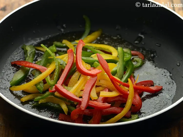 Step 3 – Add coloured capsicum which will make our pasta look colorful and attractive.&nbsp;