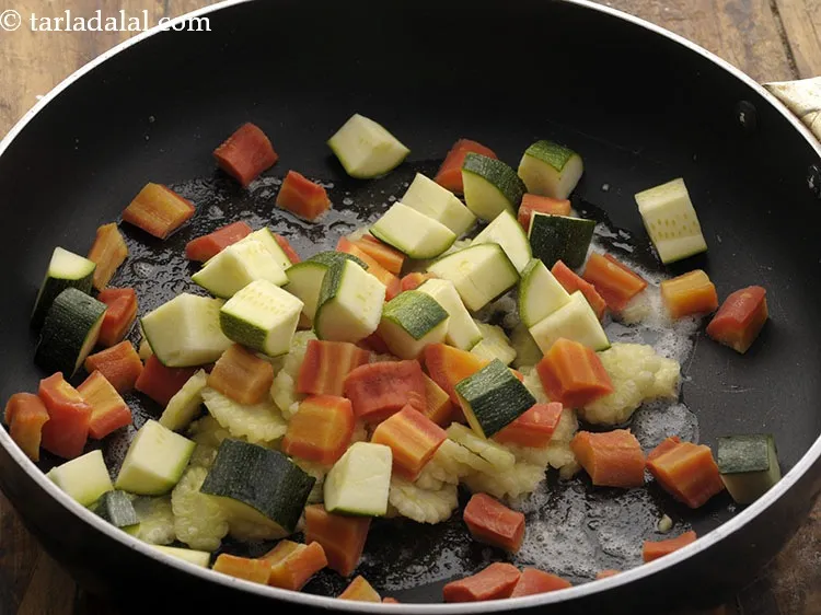 Step 16 – Add zucchini cubes. We have kept the skin intact for an extra flavor and <a …