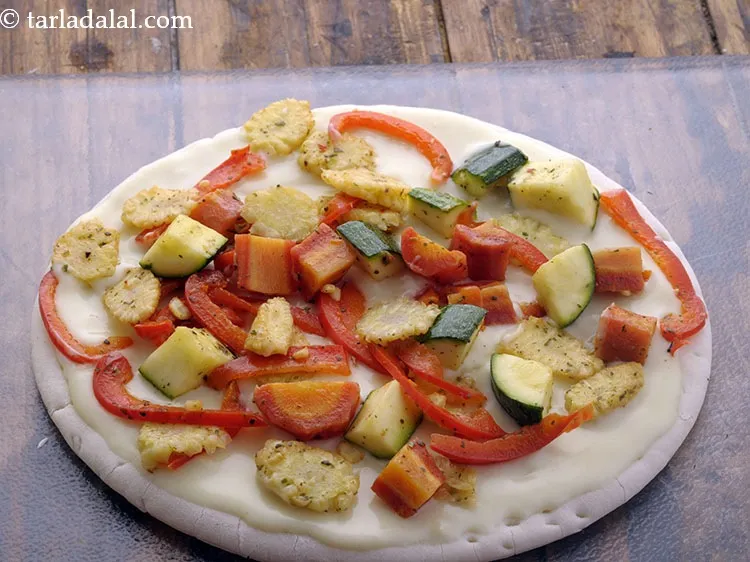 Step 25 – Arrange 1 portion of the vegetable topping evenly over it.