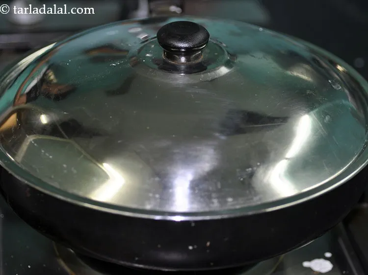 Step 35 – Cover and cook on a slow medium flame for 7-8 minutes.&nbsp;