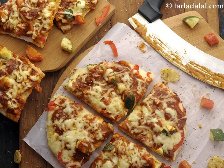 Step 32 – <div> Serve <strong>vegetable cheese pizza</strong> immediately. From authentic thin-crust pizza to a desi Indian tawa …