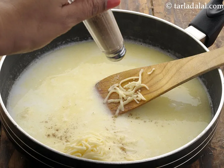 Step 11 – Add pepper &amp; season the white sauce well.