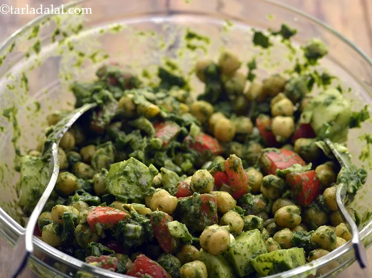 Step 23 – Toss gently using two spoons and our kabuli chana salad with mint dressing is ready.