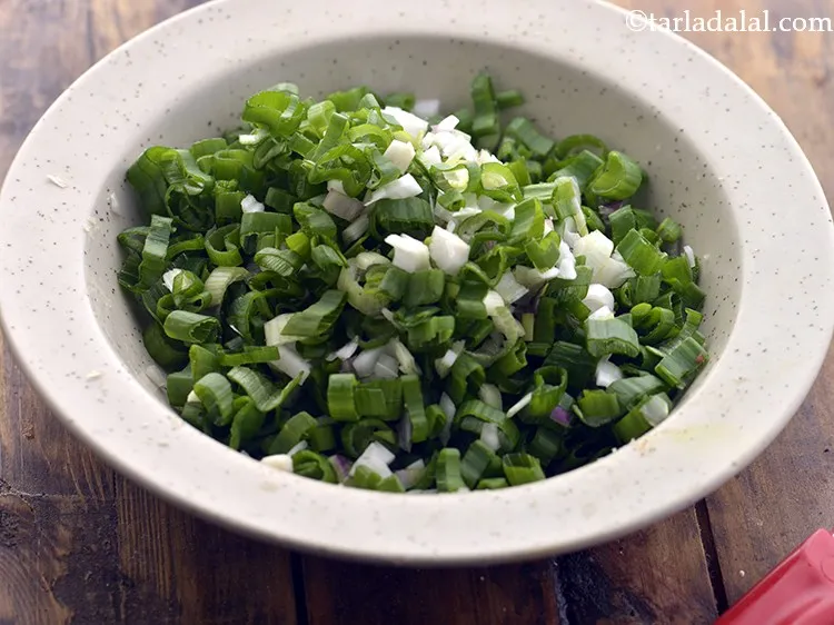 Step 9 – Also, chop spring onion greens and whites.