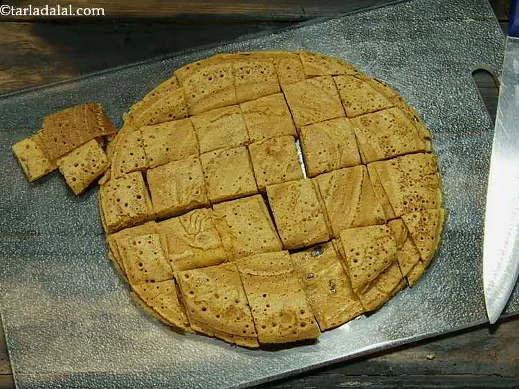 Step 17 – Place all the 4<strong> chillas </strong>one over the other and cut into 1&rdquo; square pieces.