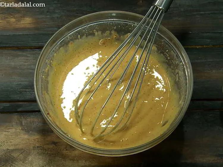 Step 8 – Add water as required and mix very well using a whisk till no lumps remain …