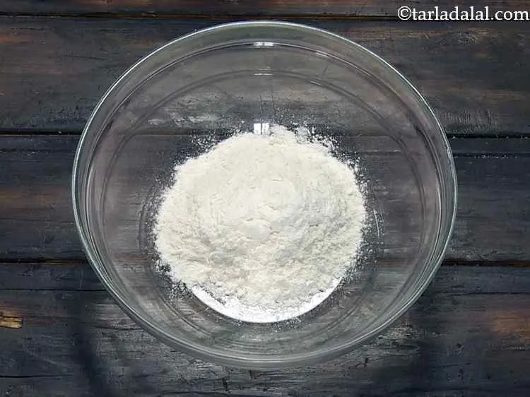 Step 7 – In a deep bowl, take plain flour.