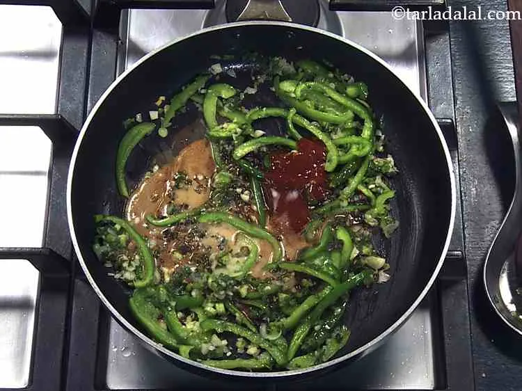 Step 19 – Finally, add the cornflour-water mixture. This reduces the sauce and coats the baby corn completely.