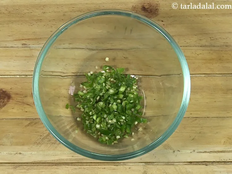 Step 2 – For the stuffing of <strong>chilli cheese paratha</strong>, in a deep bowl take finely chopped green …