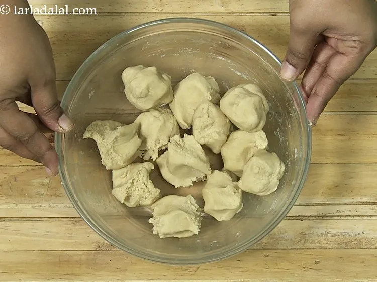 Step 18 – After 15 minutes, divide the dough into 12 equal portions and keep aside.