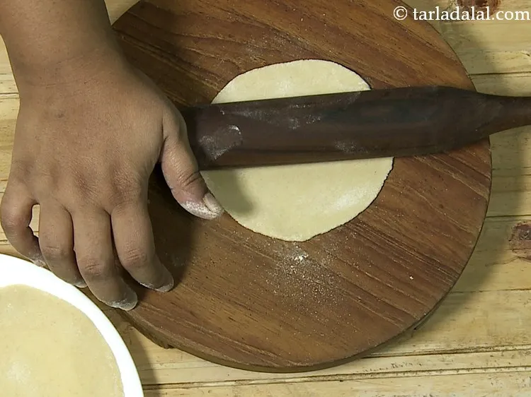 Step 19 – To prepare <strong>chilli cheese paratha</strong>, roll out 2 portions of the dough into a 150 …