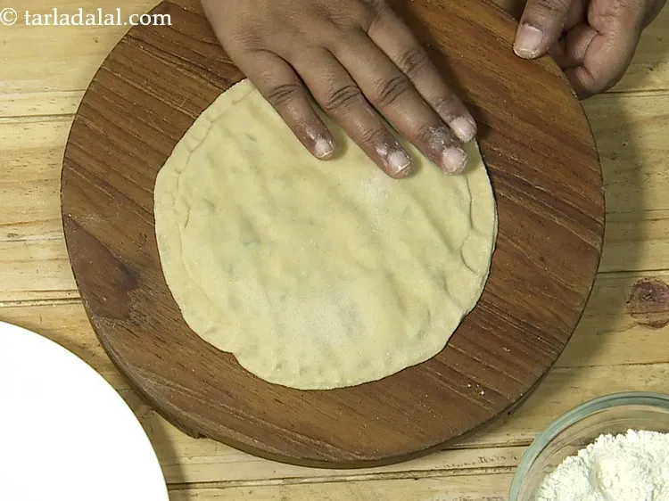 Step 22 – Cover it with another rolled circle and press it gently to seal the edges.