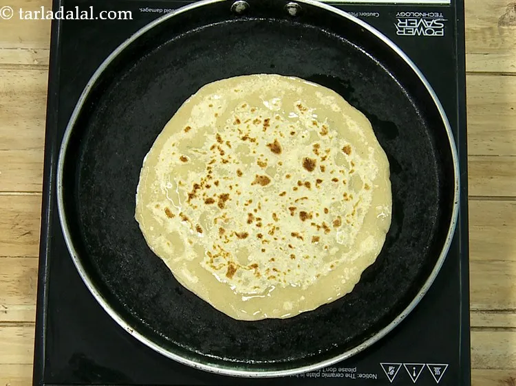 Step 24 – Drizzle 1 tsp of oil over the paratha. Oil can be swapped with ghee or …
