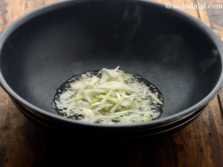 Step 8 – <p>Add spring onion whites.</p>