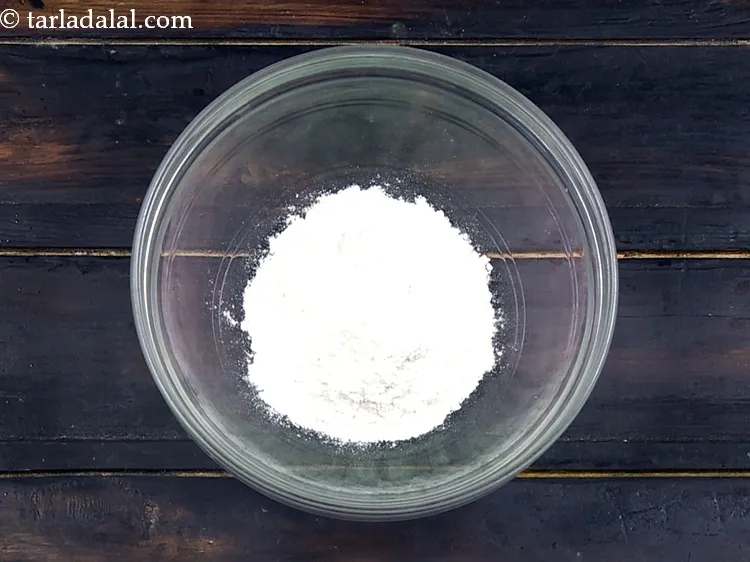 Step 10 – For the batter to deep fry mushrooms, add&nbsp;1/4 cup&nbsp;<a href="https://www.tarladalal.com/glossary-plain-flour-maida-188i">plain flour (maida)</a>.