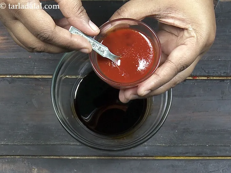 Step 23 – Add 1 tbsp&nbsp;<a href="https://www.tarladalal.com/glossary-red-chilli-sauce-lal-chilli-sauce-810i">chilli sauce</a>.