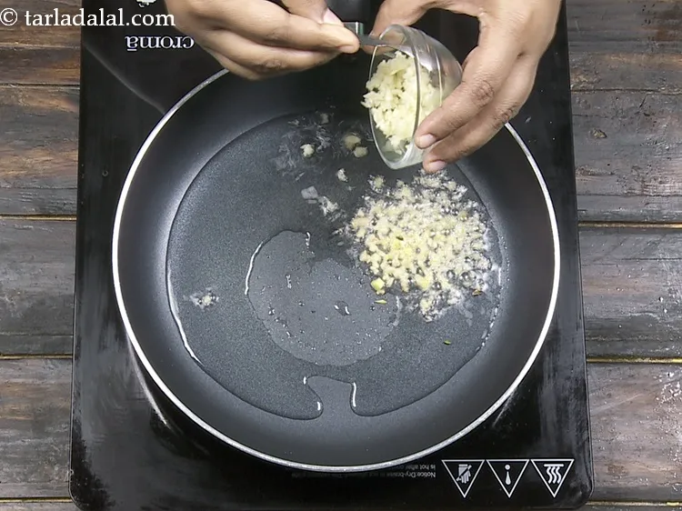 Step 31 – Add 1 tbsp&nbsp;finely&nbsp;<a href="https://www.tarladalal.com/glossary-chopped-garlic-790i">chopped garlic (lehsun)</a>.