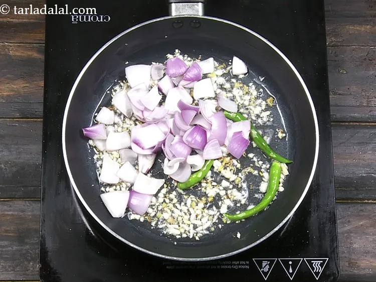 Step 34 – Add 1/2 cup&nbsp;<a href="https://www.tarladalal.com/glossary-onion-cubes-732i">onion cubes</a>.