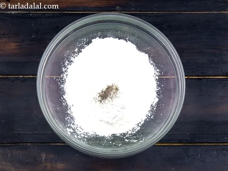 Step 12 – Add&nbsp;a pinch of&nbsp;<a href="https://www.tarladalal.com/glossary-freshly-ground-black-pepper-kalimirch-powder-kali-mirch-ka-powder-567i">freshly ground black pepper (kalimirch)</a>.