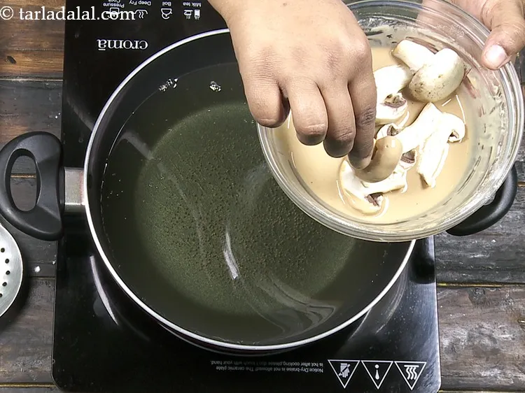 Step 18 – Dip a few pieces of mushrooms, one by one, in the prepared batter. Ensure they …