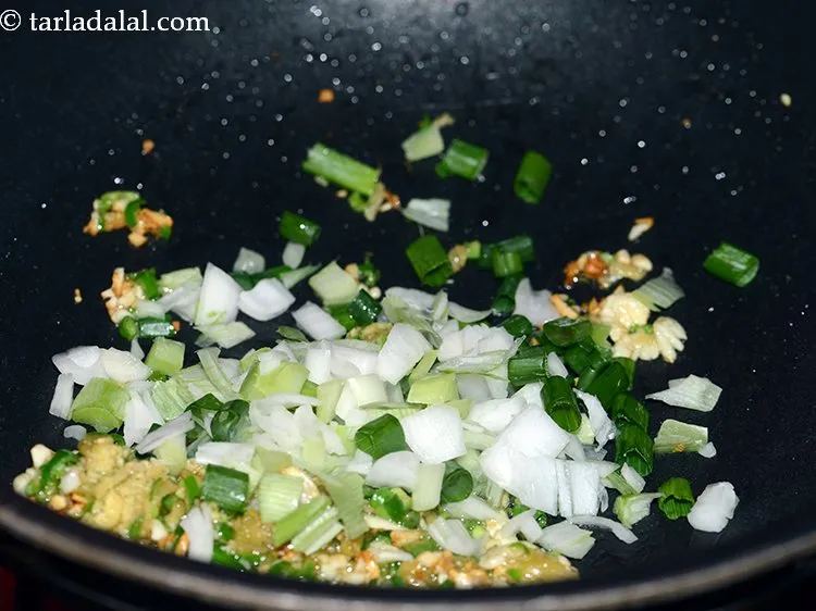 Step 22 – Add spring onions.