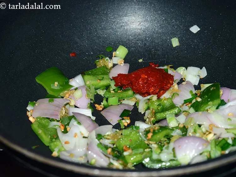 Step 26 – Add red chili paste. We have prepared red chili paste using kashmiri red chilies.