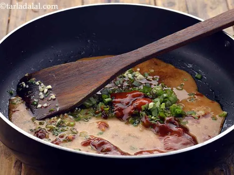 Step 24 – Add the cornflour-water mixture. This slurry helps in thickening of the sauces and help coat …