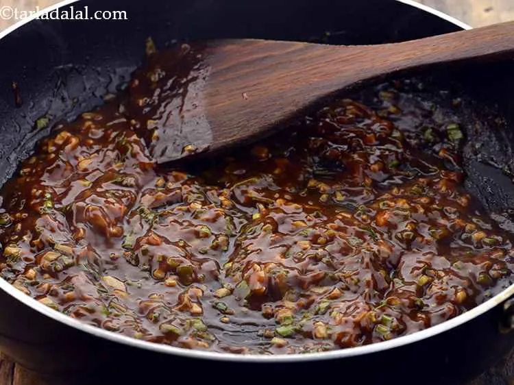 Step 26 – Cook the <strong>Chilli Potato</strong> on a high flame for a few seconds.