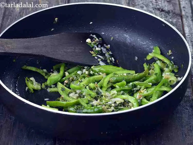 Step 16 – Add the capsicum and saut? on a medium flame for 1 minute.